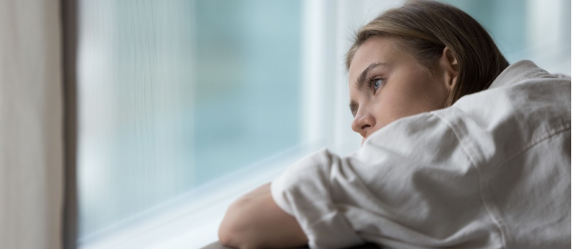 Young woman laying on couch