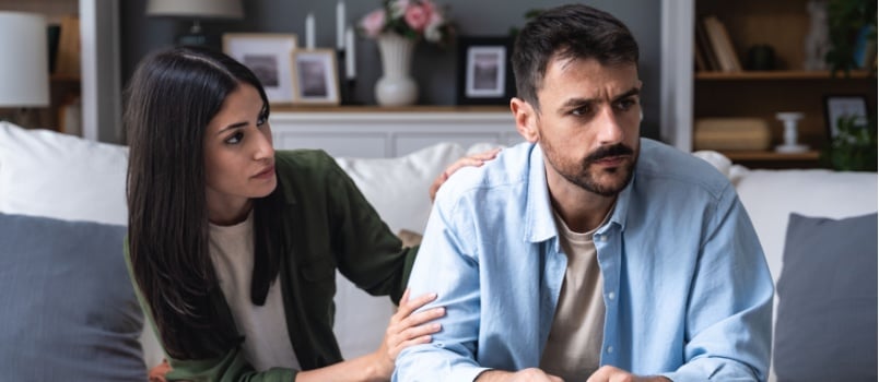 Woman comforting husband