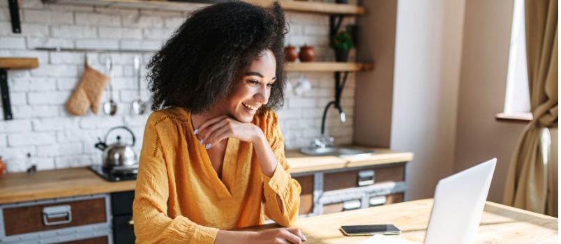 Happy girl using laptop