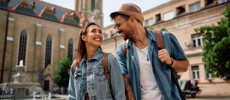 Happy tourist couple talking