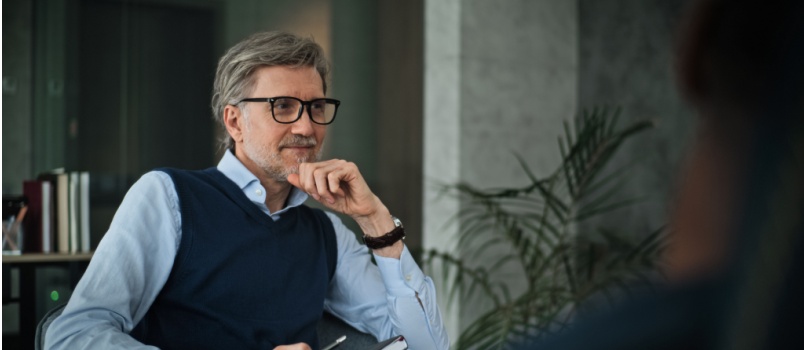 Professional psychologist sitting on chair