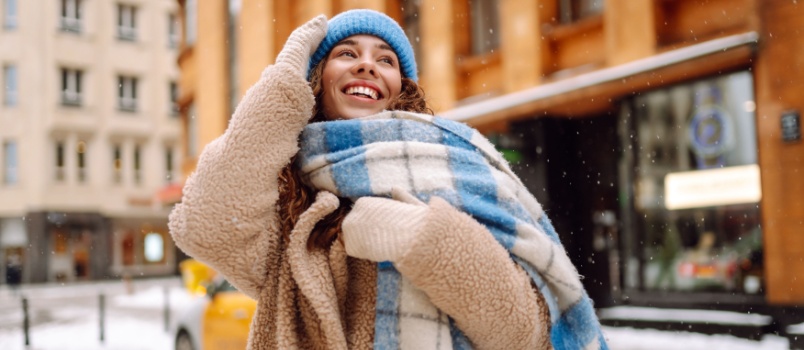 Happy woman enjoying winter season
