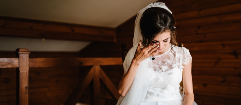 Bride crying while reading letter