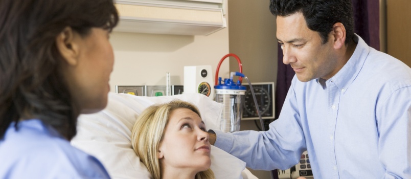 Pregnant woman talking to doctor