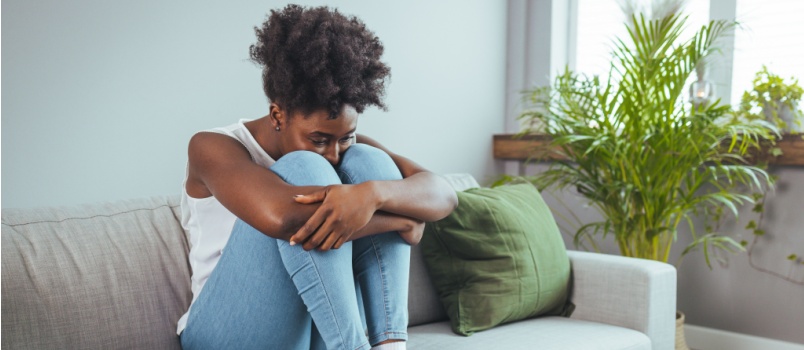 Sad woman sitting alone