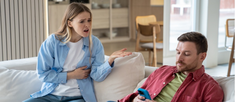 Upset man ignoring woman