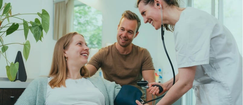gynecology nurse checking blood pressure