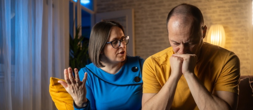 Woman comforting sad man
