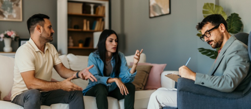 Worried couple discussing their problem