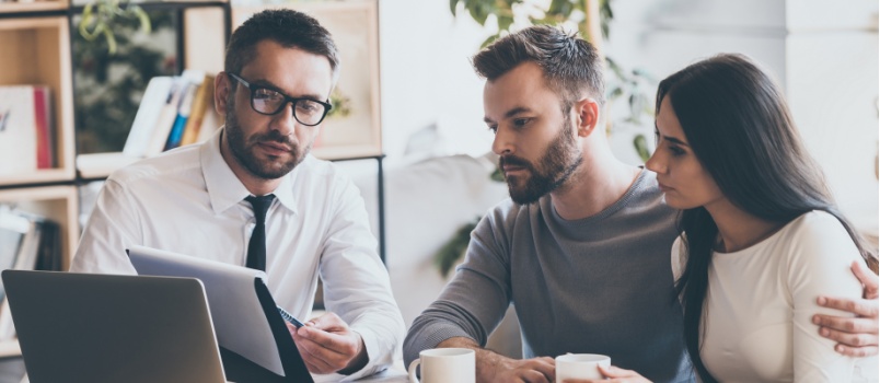 Young couple meeting agent