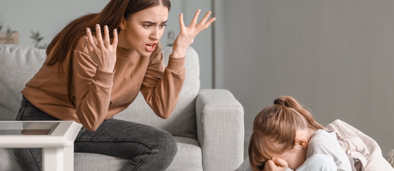 Angry mother threatening her daughter