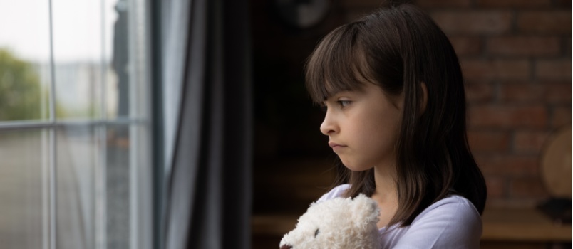 Little girl holding toy