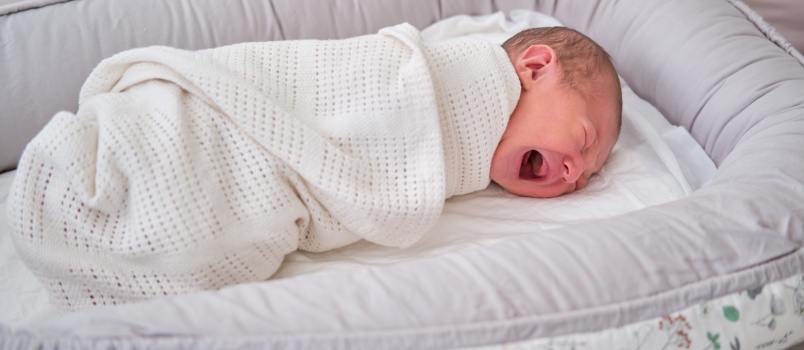 New born baby crying while sleeping