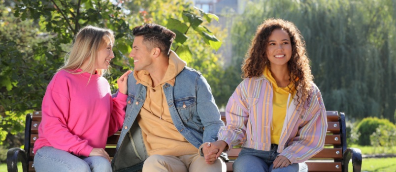 Man flirting with another woman