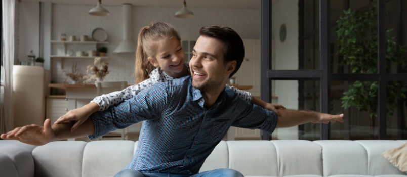 Father and daughter playing together