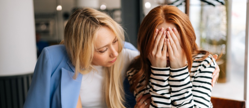 Young woman supporting her friend