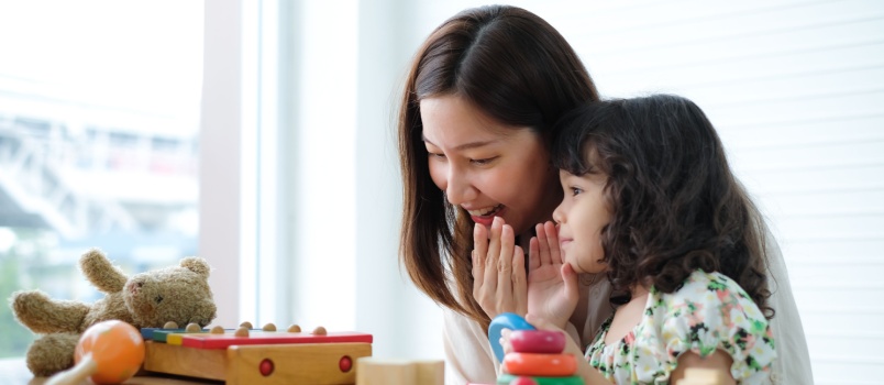 Little girl pretending whisper