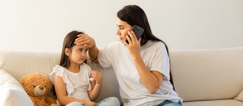 Mother taking care of daughter