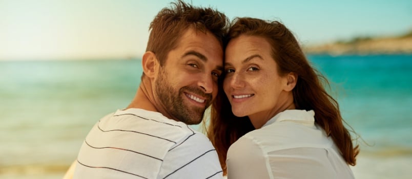 Smiling couple on beach
