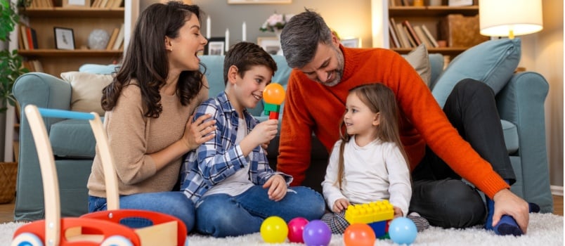 Happy family playing with kids