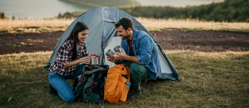 Couple enjoying viewpoint while camping