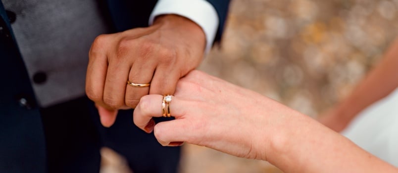 Couple showing their engagement rings
