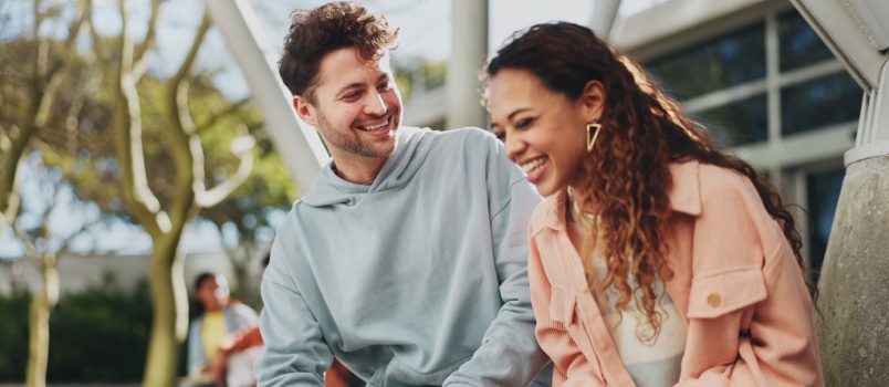 Student on leaves laughing