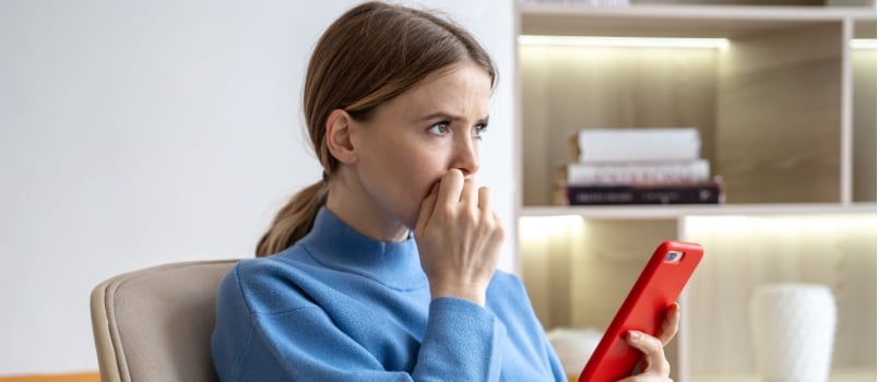 Woman receiving unpleasant messages