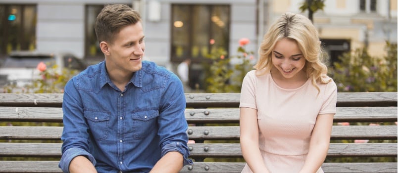 Young couple sitting on bench