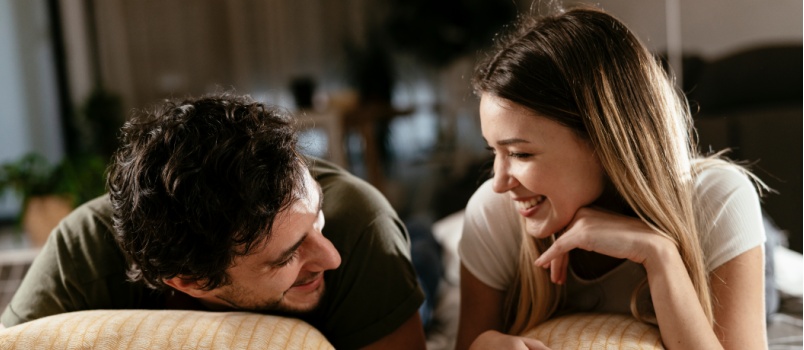 Young couple relaxing on bed