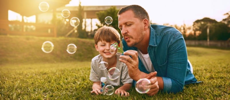 Dad and son playing together