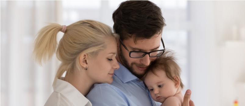 Couple holding new born baby