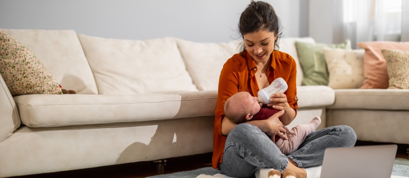 Mother feeding baby with bottle