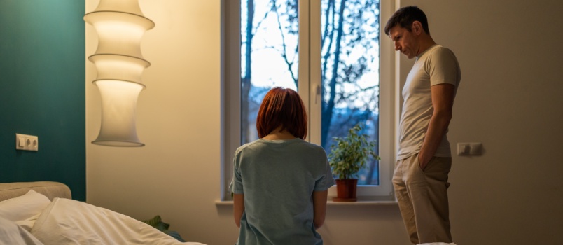 Man comforting upset woman