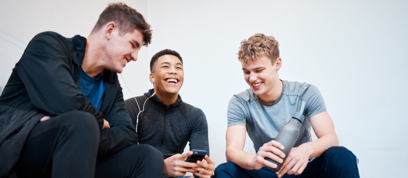 Friends talking in locker room
