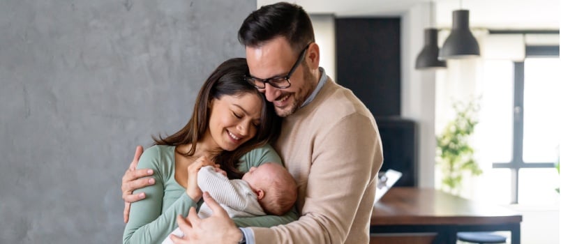 Couple holding new born baby