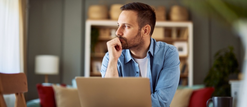 Man looking outside window