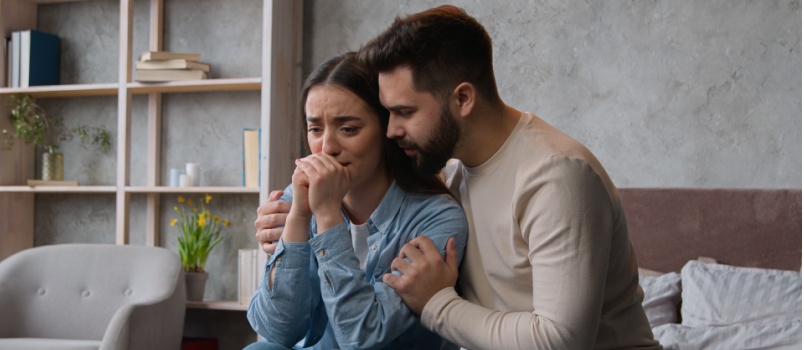 Husband comforting wife