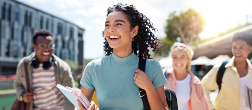 Confident woman walking smiling 