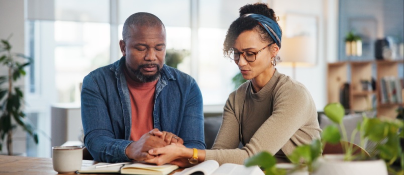 Couple praying bible religion ritual