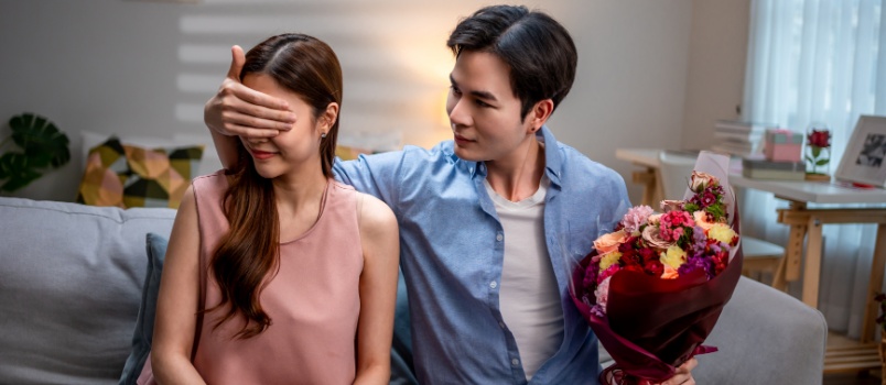 Man surprising woman