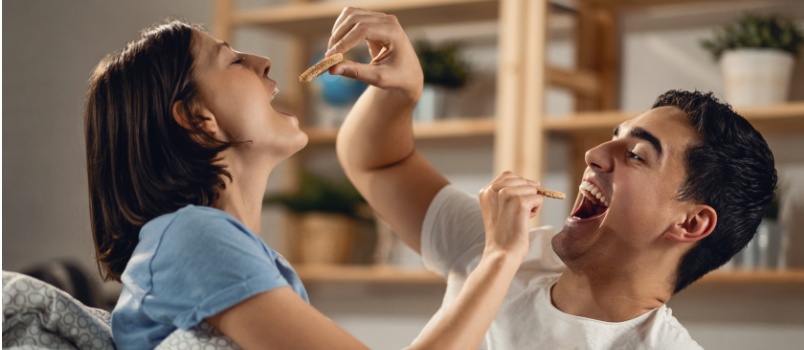Couple feeding each other