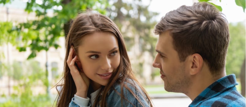 pretty girl touching her hairs while flirting 