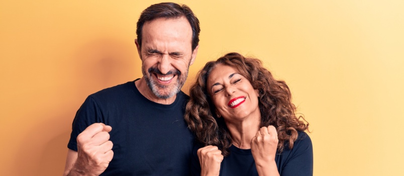 Happy excited middle age couple