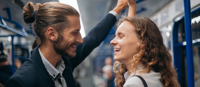 couple standing in subway train