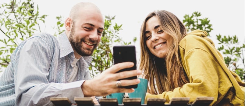 Young couple using smartphone