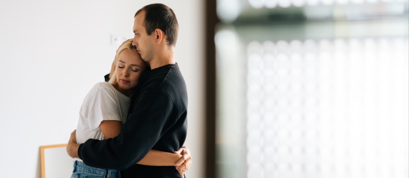 Young couple comforting each other