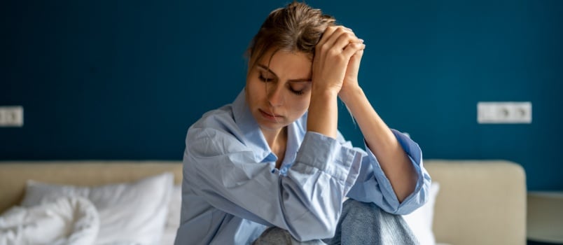 Depressed woman sitting alone