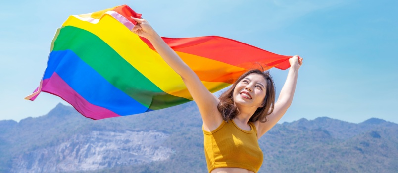 Woman holding pride flag 