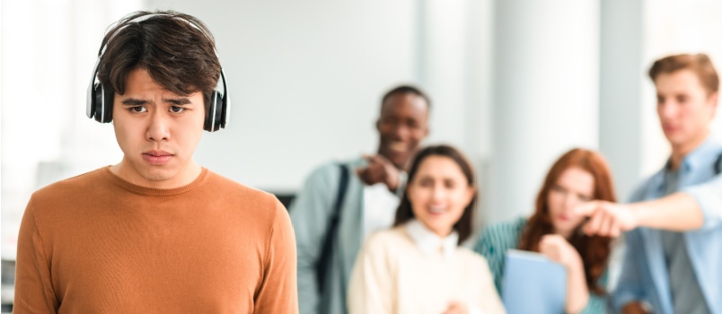 people mocking making fun of sad man